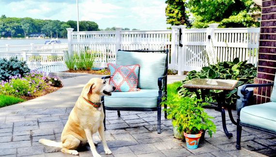 Outdoor patio space white fence and furniture