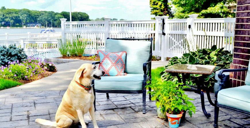 Outdoor patio space white fence and furniture