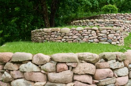 Stones and green grass, front yard. Landscape design Stones and green grass, front yard. Landscape design
